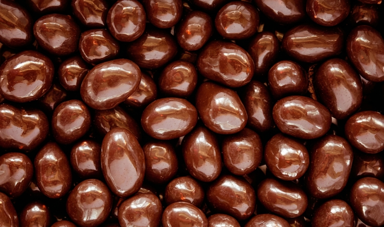 Chocolate coated peanuts in milk, dark and white chocolate variants - premium confectionery for gifting and retail